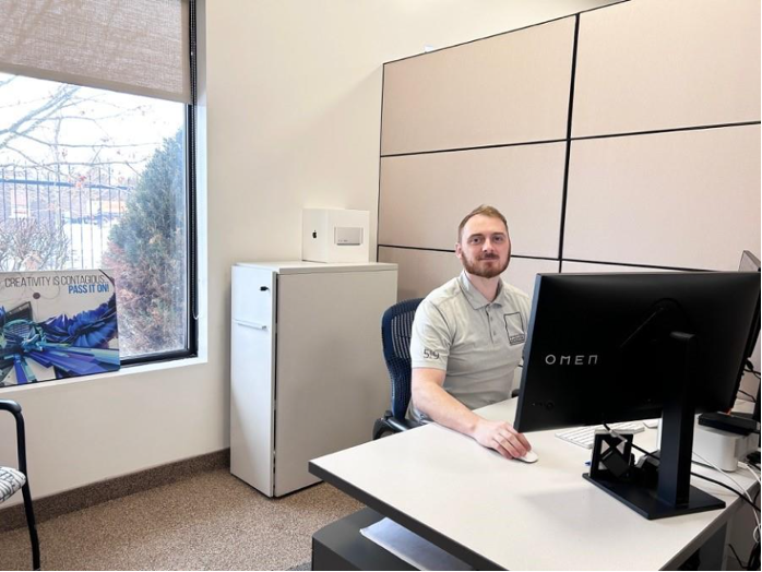 Window Film Systems employee working with client files at desk