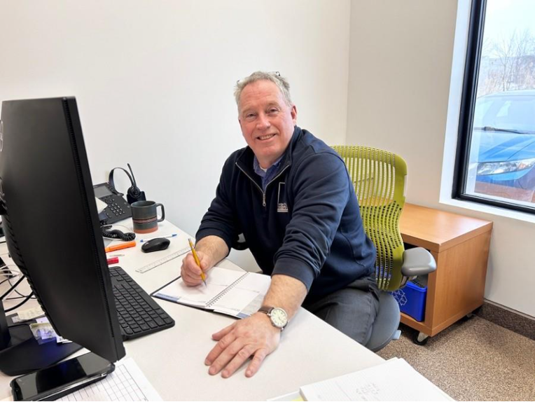 Window Film Systems staff collaborating at their desk in London office